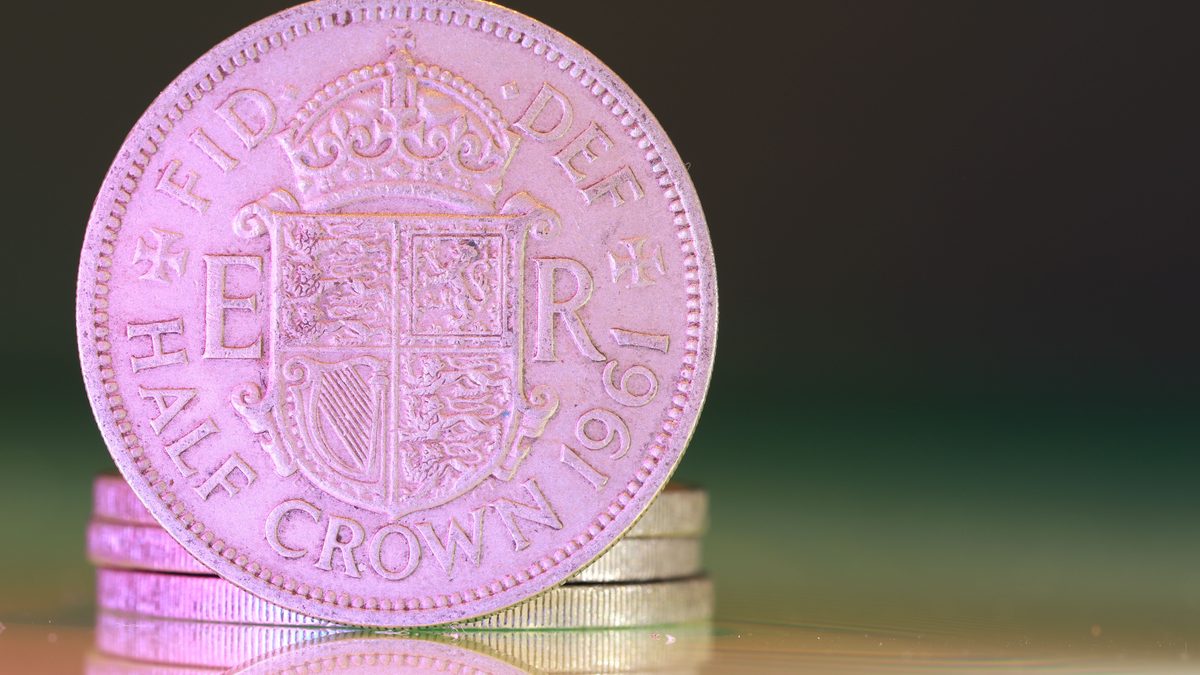 Detailed macro shot of a 1961 British half crown coin, showcasing historical design.