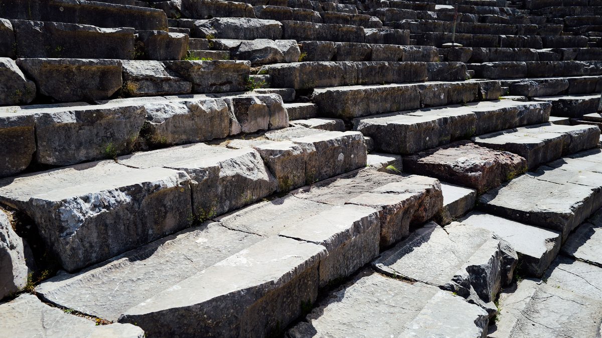 Explore the weathered charm of ancient stone steps bathed in natural light.