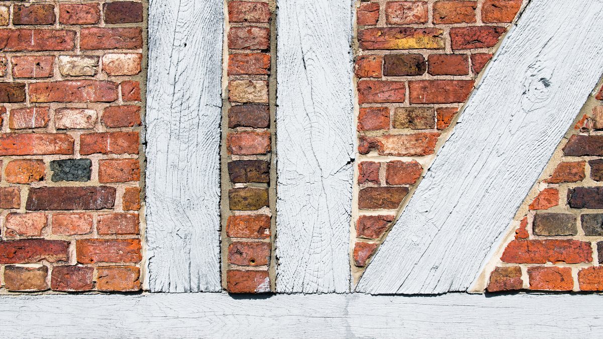 Close-up of a timber-framed red brick wall in Geesthacht, Germany showcasing old architecture.